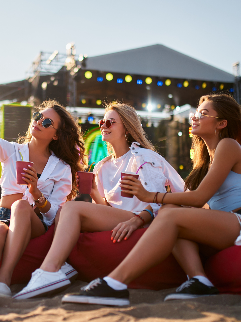 friends enjoying drinks at summer music festival